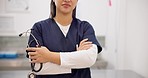 Woman, hands and doctor arms crossed with stethoscope for professional healthcare or medical service at hospital. Closeup of female person or nurse in confidence with tools or equipment for health