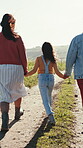 Holding hands, countryside and girls skipping on holiday in nature together as bonding on a farm for vacation. Road, siblings and women with child for travel on a field or sustainability landscape