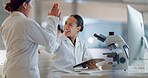 Teamwork, scientist or doctors high five for success, medicine breakthrough or partnership in lab. Science, collaboration or happy women celebrate medical support, goal target or DNA news with smile