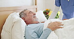 Old man laughing, bed support or caregiver in nursing home, retirement clinic for wellness or recovery. Funny nurse, happy or sick elderly patient talking to doctor or social worker for medical help