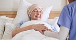 Old woman, nurse hands and support in bed at home, care and help in rehabilitation. Happy caregiver, bedroom and comfort sick elderly patient, conversation and medical healing, healthcare or wellness