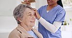 Hair, brush and senior woman with caregiver grooming, routine and helping a person with beauty in nursing home. Elderly care, nurse and brushing, haircare or help in retirement, bathroom or house