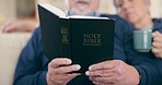 Home, closeup and senior couple with bible, faith and religion with support, guidance and worship. Christian, elderly man or old woman on a sofa, holy scripture and spiritual with retirement or relax