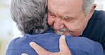 Home, hug and old couple with support, marriage and empathy with support, respect and commitment in a lounge. Compassion, senior man and elderly woman embrace, retirement and relationship with care