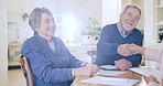 Home, senior couple and documents with handshake, retirement and meeting with pension fund, financial advisor and agreement. Worker, elderly man and old woman with paperwork and insurance in a lounge