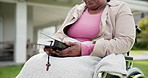 Senior woman, disabled person and bible with prayer, outdoor and holy spirit for health, faith and guidance. Christianity, peace and pray for wellness, jesus and believe in god, hands and religion