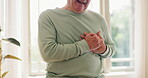 Hands, heart attack or senior man with emergency in massage chest, cardiovascular problems or home alone. Pain, person, retirement or anxiety in living room in cardiac arrest, injury or medical help