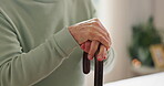 Walking stick, hands and senior person with disability in home for support, healthcare and help in retirement. Elderly patient, closeup and cane for balance of arthritis, parkinson and rehabilitation