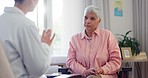 Mature, woman and doctor for consulting in office for diagnosis in health, wellness and elderly care. Senior person, serious face and listening to medical advice for results, conversation or planning