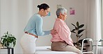 Physiotherapist, senior woman and back pain for support, healthcare service and physical therapy in clinic office. Physiotherapy, chiropractor or doctor with patient muscle, massage and consultation