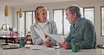 Senior couple, documents and stress for home debt, financial fail or budget risk with fight, argue and frustrated. Angry elderly woman and man paperwork, loan and inflation or bankruptcy on laptop