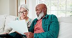 Old couple on sofa with tablet, paperwork and home budget with interracial marriage, discussion and planning. Bills, online banking and fintech, senior man and woman on couch with retirement savings.