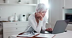 Senior woman, laptop and home for online research, asset management and planning retirement or pension application. Serious, mature person on computer of life insurance, policy or website information