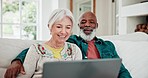 Old couple on couch with laptop, smile and relax with love, interracial marriage and online bonding in home. Computer, streaming website and happy people, senior man and woman on sofa in living room.