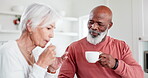 Senior, couple or coffee with communication in kitchen for relax, peace and bonding in interracial relationship. Elderly, black man or woman drinking tea with conversation or talking at home for love