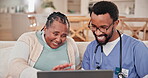 Laptop, healthcare or home with a nurse and patient consulting on a sofa in the living room during retirement. Computer, medical and a black man caregiver speaking to a senior woman in an apartment
