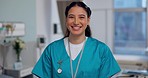 Nurse, face and happy woman in healthcare, smile with confidence at hospital with pride and help, caregiver with kindness. Medical professional, trust at clinic with expert in portrait and health