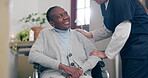 Medical, smile and a nurse talking to an old woman in a wheelchair for trust, care or assistance. Healthcare, support and a happy young caregiver chatting to a senior patient with a disability