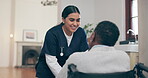 Healthcare, smile and a caregiver talking to an old woman in a wheelchair for trust, care or assistance. Medical, support and a happy young nurse chatting to a senior patient with a disability