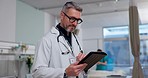 Man, doctor and tablet in research for medical, healthcare or Telehealth in communication at hospital. Male person, nurse or surgeon with technology for networking, study or online search at clinic