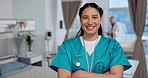 Nurse, face and woman in healthcare, arms crossed with confidence at hospital with pride and help, caregiver and smile. Medical professional, trust and happy at clinic, expert in portrait with health