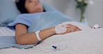 Hospital, emergency and hand of woman with iv drip in a bed for liquid, hydration or treatment. Healthcare, medicine and female patient with fluid, supplement and health, monitoring or recovery 