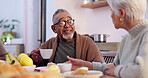 Senior couple, conversation and happy in kitchen, home and coffee for love, relax and enjoy. Retirement, old age and elderly in house, bonding together and quality time for discussion, man and woman
