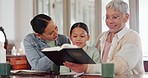 Family, kid and reading Bible for religion, christian education and learning of God with grandmother and mom at home. Senior woman and girl child with holy book, talking of gospel, faith or scripture