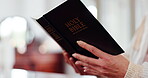 Hands, woman and reading bible, book and praying at home for spiritual faith, holy trust and worship to God. Closeup, christianity and learning prayer for religion, gospel and praise to jesus christ 