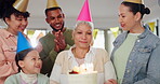 Family, singing and happy birthday for grandmother, celebration and love for senior woman with cake. Smiling people, embrace and appreciation or support for elderly person, event and party hats