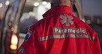 Back, man and paramedic walking to ambulance for emergency, ems service and healthcare in city. Rear view, medical professional and doctor outdoor at night for first aid, rescue operation and work