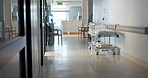 Empty hospital, corridor and bed for healthcare, wellness and medical treatment, surgery or help in lobby. Clinic interior, hallway and emergency room with stretcher for support, service or medicine