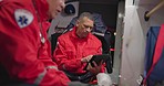 Talking, man and a tablet at sea for rescue team, communication and emergency at sea. Teamwork, digital and a medical employee working on a boat with tchnology for service, analysis or research