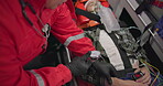 Watch, pulse and hands of a paramedic with a patient in an ambulance for rescue during an emergency or accident. Heartbeat, time and service with an emt closeup in a vehicle to save a man from above