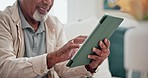 Closeup, hands and man with a tablet on the sofa for communication, reading news or email online. Digital, smile and a person typing on technology for an app, chat or search on the internet from home