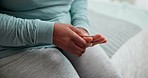 Hand pain, stress and closeup of senior woman on a bed with arthritis, osteoporosis or fibromyalgia. Zoom, anxiety and elderly female person with finger massage for relief from wrist injury or ache