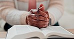 Hands, prayer and Bible, cross for worship and God, Christian at home with closeup of praying and study scripture. Religion, wellness and person has crucifix, faith and search for guidance with trust