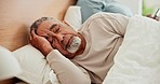 Senior couple, divorce and man ignore woman in a bed after fighting, argue or dispute at home. Marriage, crisis and elderly male in a bedroom with cheating wife, menopause or social media addiction