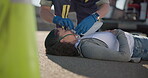 Hands, emergency or oxygen and a paramedic with a woman patient or victim on the street for accident treatment. Healthcare, medical or first aid with an emt working to rescue an injured person