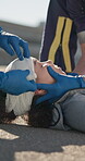 First aid, hands of paramedic and bandage on woman in accident, head injury and emergency. Closeup, medical team and dressing wound of ems patient for healthcare, help and rescue on street outdoor