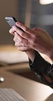 Hands, phone and night in office for woman, computer and texting for networking, contact or research. Person, smartphone and typing with social media app, email notification and communication at desk