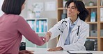 Doctor, woman and handshake in office with communication for healthcare, medical support or wellness. Professional, employee or person with patient for conversation, advice or consultation at clinic