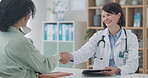 Smile, doctor and handshake of patient to welcome, greeting and meeting in hospital. Happy medical worker shaking hands with woman, consultation and conversation for healthcare, checkup and wellness