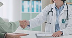 Closeup, doctor and handshake of patient to welcome, greeting or meeting in hospital. Happy medical worker shaking hands with woman, consultation and conversation for healthcare, checkup and wellness