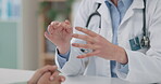 Hands, healthcare and a doctor talking to a patient closeup in the hospital for consulting or diagnosis. Medical, trust or feedback appointment with a medicine professional and client in conversation