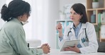 Meeting, woman and doctor with results on tablet in conversation with patient in office, clinic or healthcare. Medical, talk and people in consultation with tech for medicine, research and report