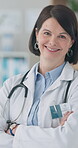 Woman, surgeon and doctor with arms crossed in office for cardiology, medicine and healthcare. Medical, worker and portrait in London hospital with professional health care and service in clinic