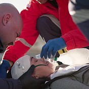 Medical emergency, accident and patient with oxygen mask on road for ...