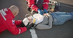 Emergency, paramedic and people on road for accident, injury and car crash for saving patient. Healthcare, ambulance and health emt with person for medical service, care and first aid in street