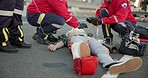 Emergency, ambulance and people on road for injury, accident and car crash for saving patient. Paramedic, healthcare and health emt with person for medical service, care and first aid responder